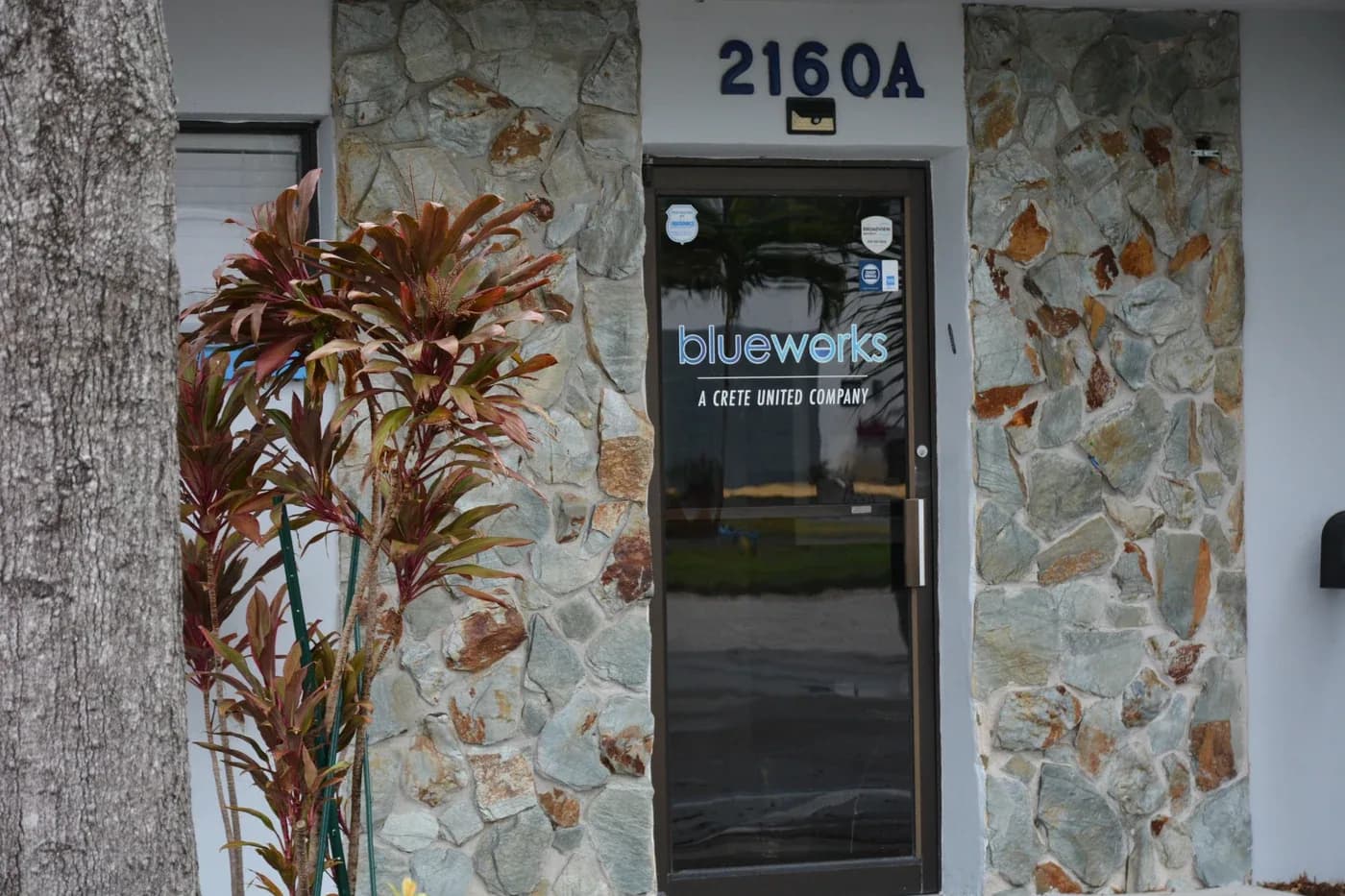 Blue Works office entrance with the company logo and suite number 2160A