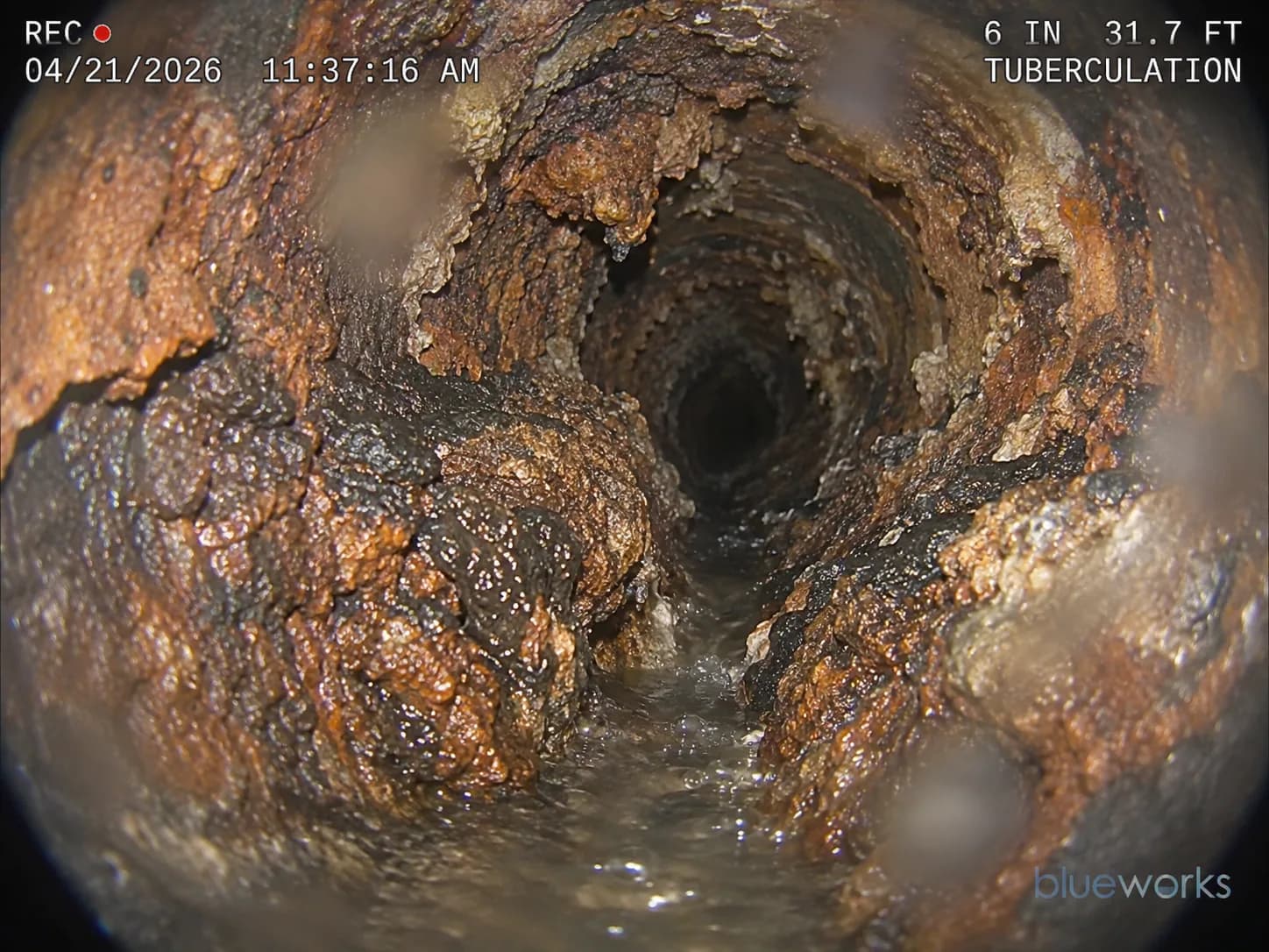 Severe tuberculation restricting a cast-iron drain